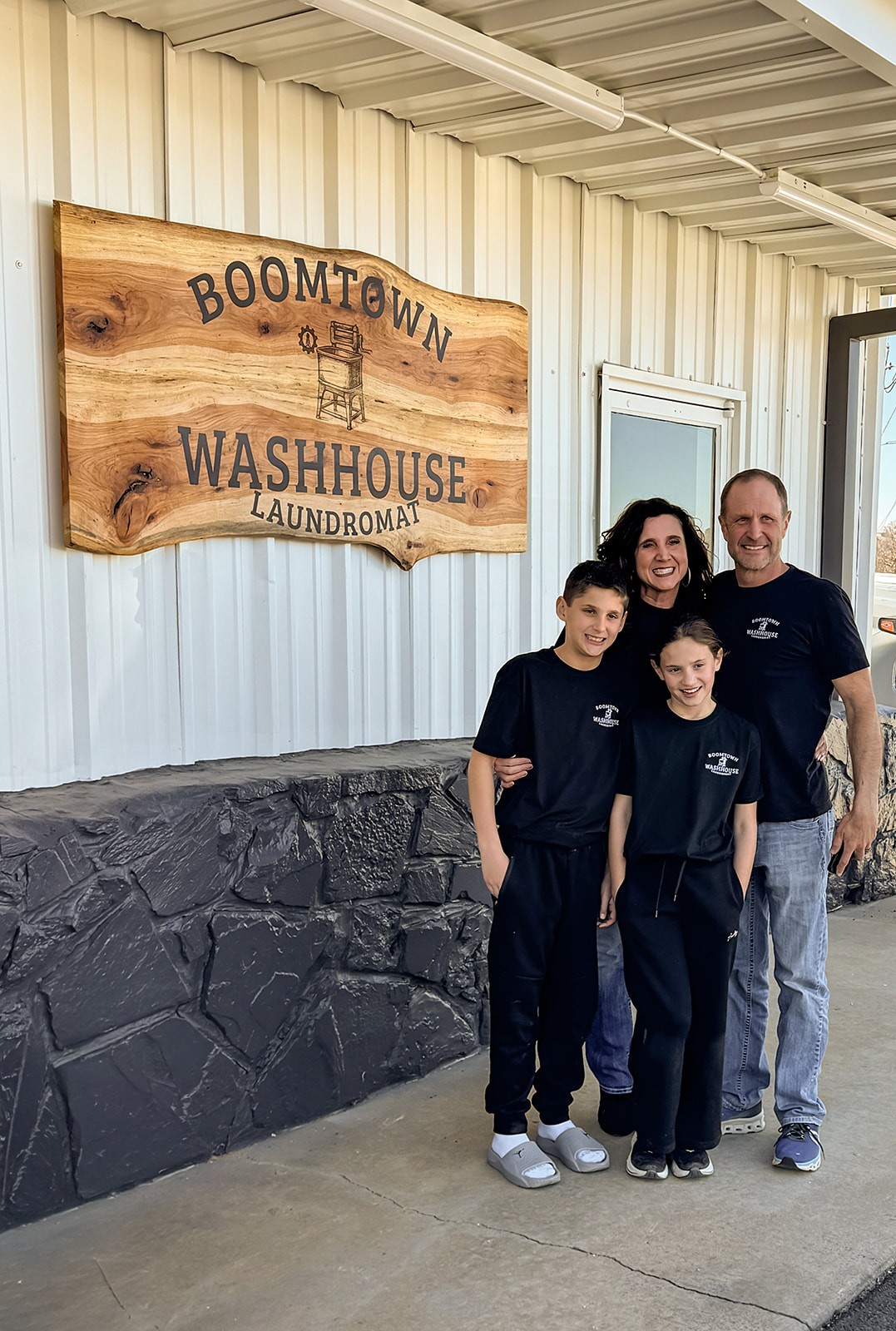 Family Photo In Front Of Sign